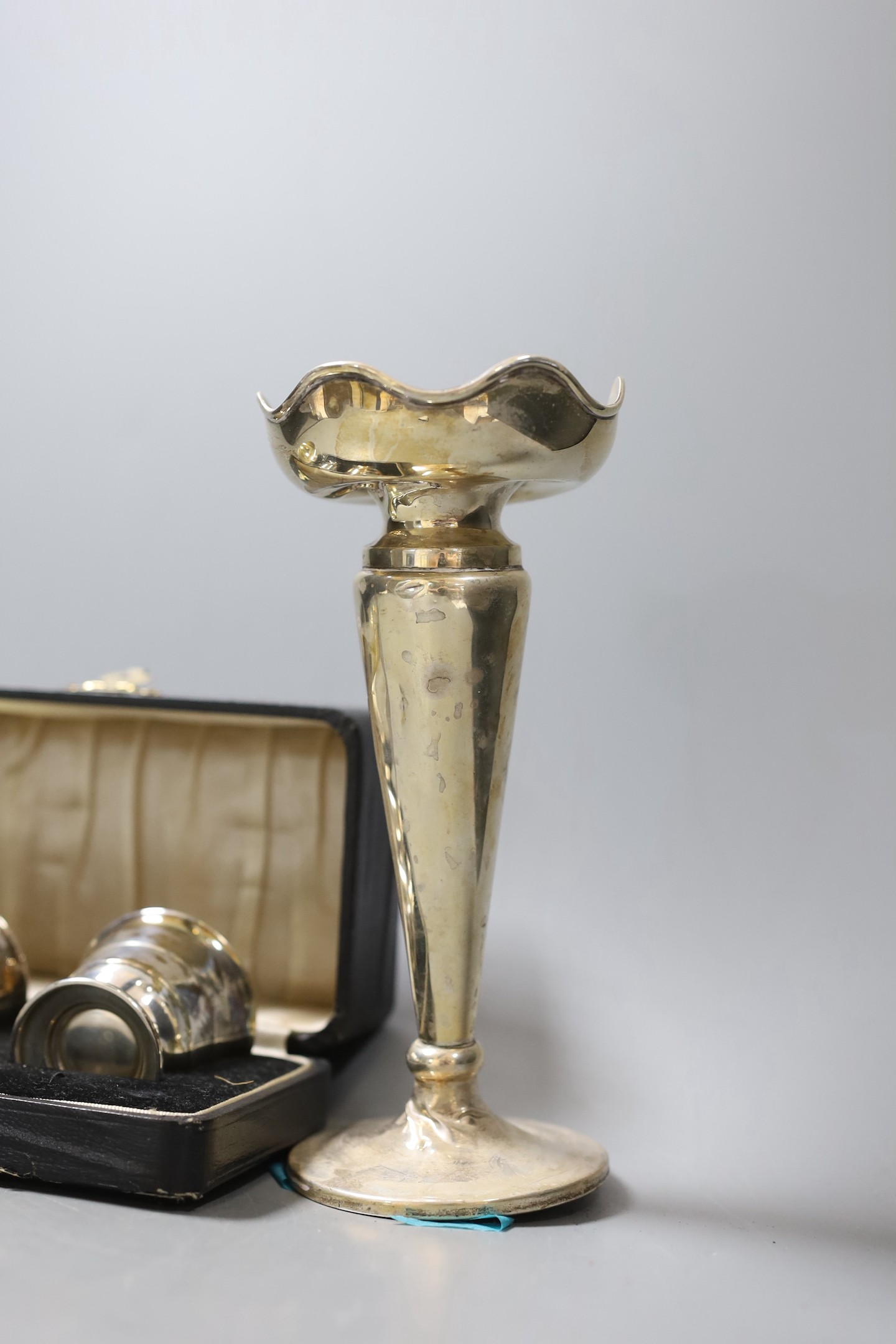 A modern silver sugar bowl, 11.2cm, 6oz a case pair of silver salts and a silver mounted trumpet vase.